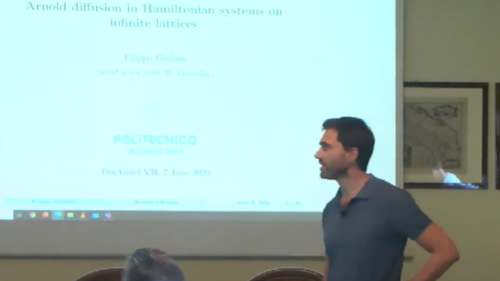 Arnold diffusion in Hamiltonian systems on infinite lattices